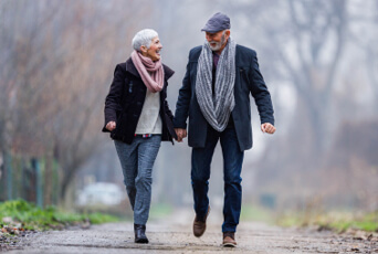 Active senior couple walking together