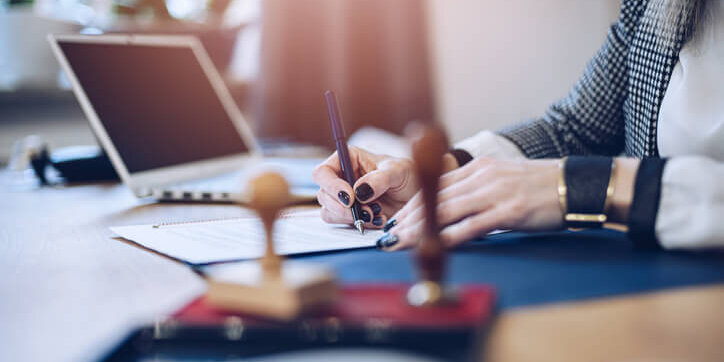 Woman filling out estate planning docuemnts