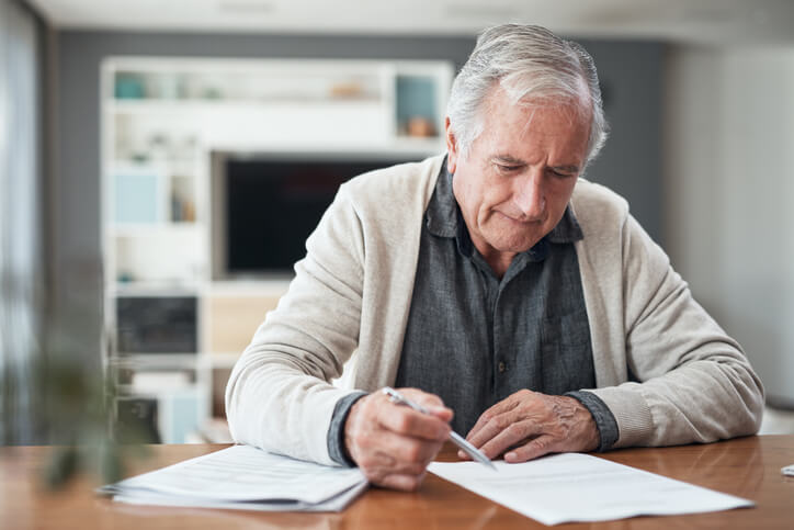Older man writing his will