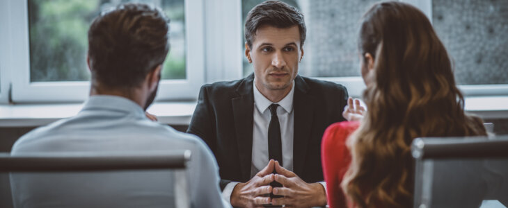 divorce mediator sitting with clients